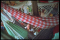 093068 Person Finding Room Among Hammocks On Ferry A4 Photo Print