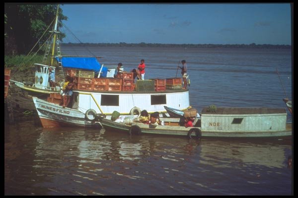 093093 Two Boats Transferring Cargo On The Amazon A4 Photo Print