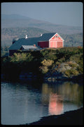 097046 Red Dairy Barn Beside Water A4 Photo Print