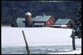 097052 Red Barns In Snow From Barbed Wire Fence A4 Photo Print