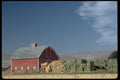 097061 Barn With Green And Yellow Hay Bales A4 Photo Print