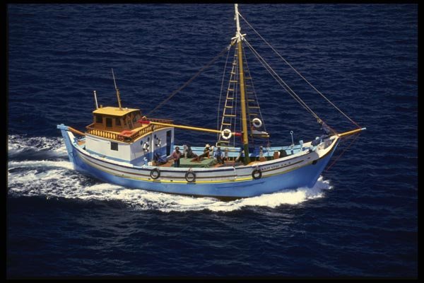 118008 Colorful Trawler Heads Towards Mykonos A4 Photo Print