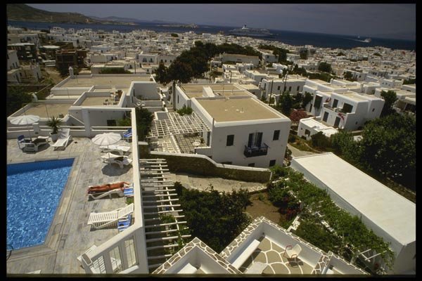 118024 Relaxing Poolside At A Popular Mykonos Inn A4 Photo Print