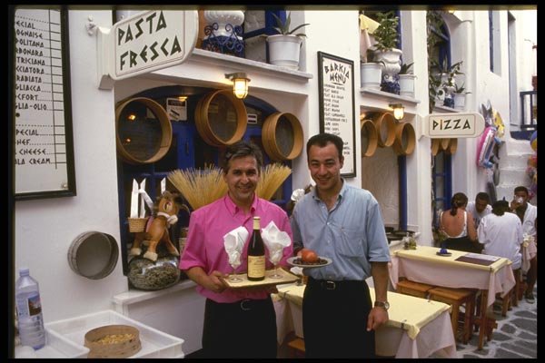118043 Mykonos Wine, Pasta And Friendly Service A4 Photo Print