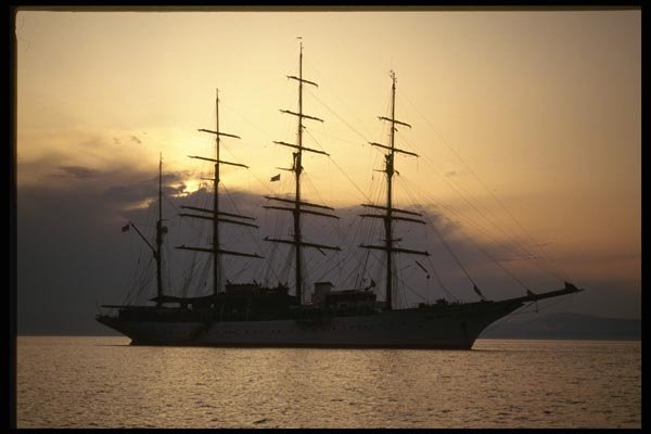 118049 The Sun Sets Behind The Anchored Schooner A4 Photo Print