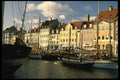 121072 Boats Along Nyhavn With Black Hull Boat In Foreground A4 Photo Print