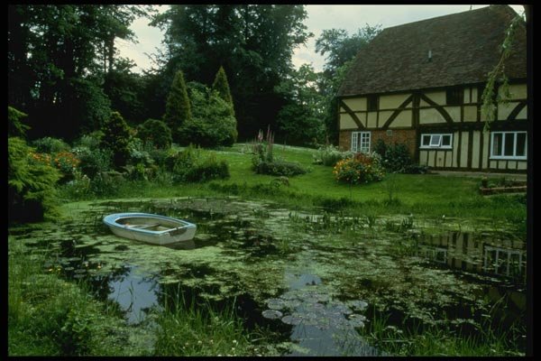 131008 View Across Pond To 15th Century House With Rowing Boat A4 Photo Print