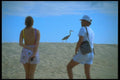 139092 Tourists On Beach A4 Photo Print