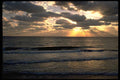 178015 Sunrays Through Clouds Behind Ocean A4 Photo Print