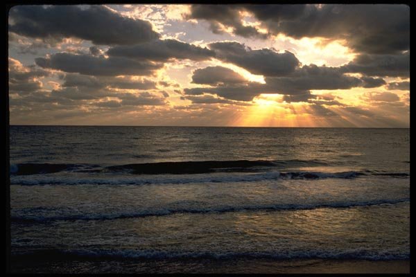 178015 Sunrays Through Clouds Behind Ocean A4 Photo Print