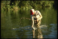 185063 Angler Reaches For Big Fish A4 Photo Print