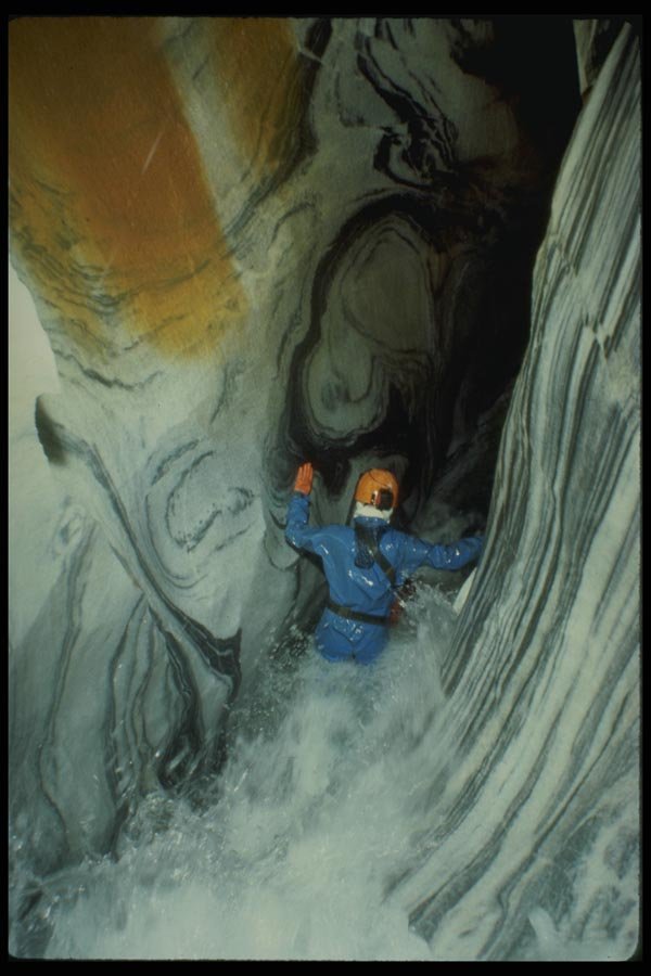194023 Caver Descends Into Wet Canyon In Banded Marble, CA A4 Photo Print