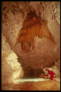 194057 Dipping From A Pool Beneath Orange Flowstone, Lechuguilla A4 Photo Print
