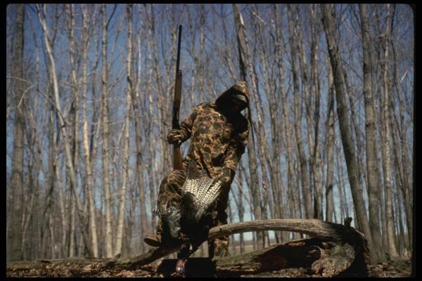 195057 Turkey Hunter Hefts Downed Bird A4 Photo Print