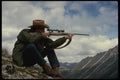195081 Mountain Hunter Aims At Game Across Canyon A4 Photo Print