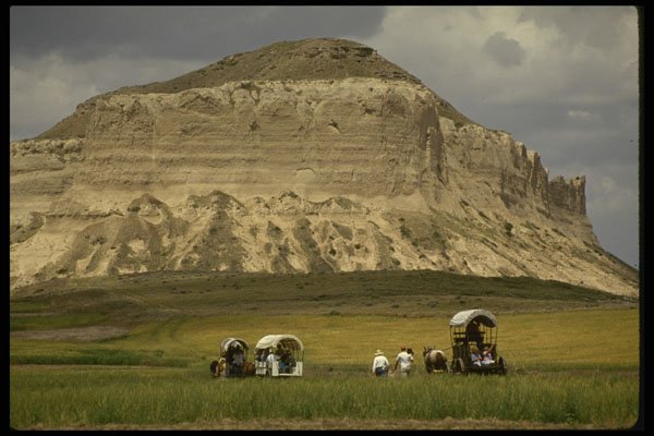 216035 Wagon Train Approaching Whiskey Rock, Nebraska A4 Photo Print