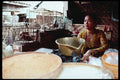 217040 Yogyakarta, A Birdseed Seller At The Public Market A4 Photo Print