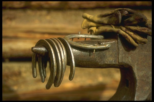 220056 Horseshoes On Blacksmith's Anvil A4 Photo Print