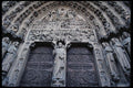 223083 Relief Carvings Surrounding Doors Of Notre Dame Cathedral A4 Photo Print