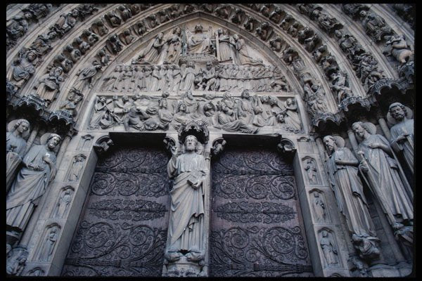 223083 Relief Carvings Surrounding Doors Of Notre Dame Cathedral A4 Photo Print