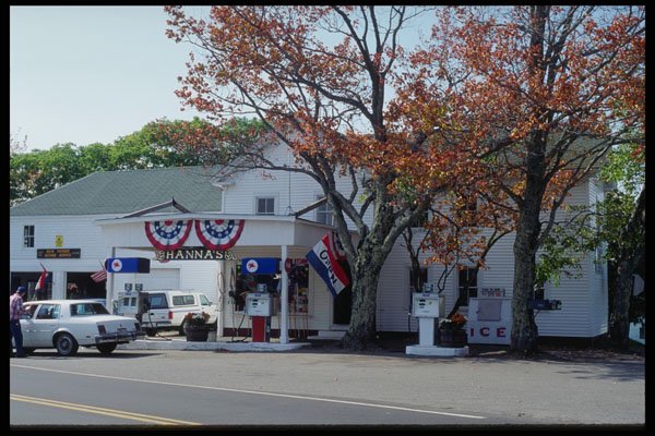 228035 Gas Station With American Flags At New Harbor A4 Photo Print