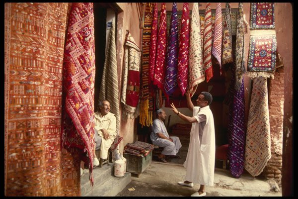 229064 Bargaining For Oriental Carpets, Marrakesh Bazaar A4 Photo Print