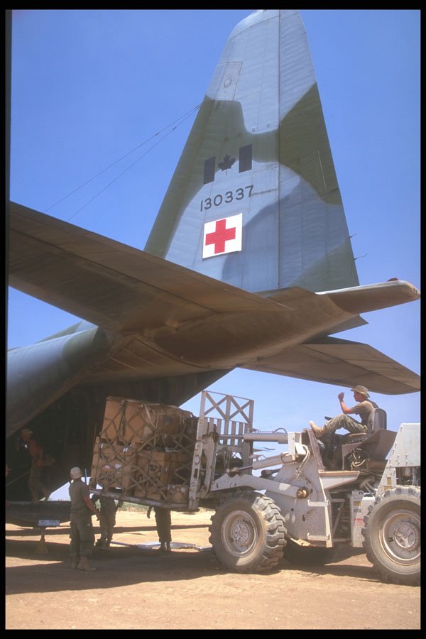 245038 Red Cross Supplies Being Unloaded From C 130 Hercules A4 Photo Print