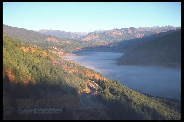 246084 Bumthang Valley in low clouds A4 Photo Print