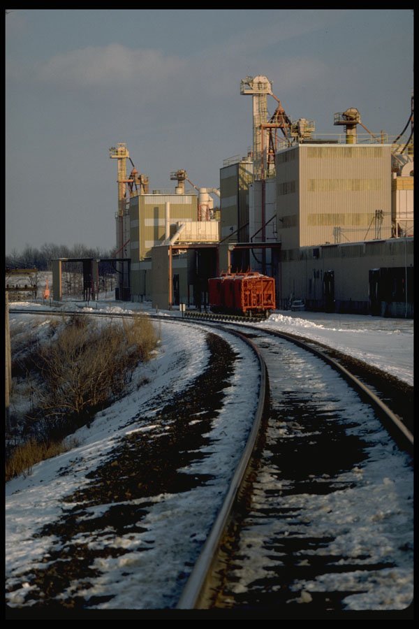 250091 Railroad Tracks By Plant In Winter A4 Photo Print