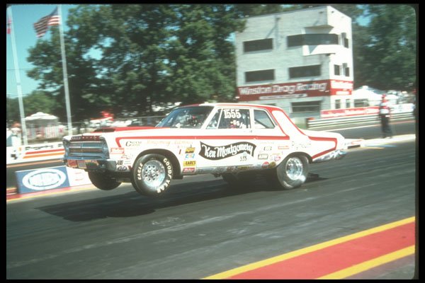273079 A Super Stock Dodge Pulls The Wheels Coming Off The Line A4 Photo Print