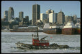 277015 Skyline And Tug Boat A4 Photo Print