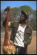 296084 Wood Carver And Giraffe A4 Photo Print