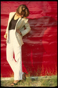 302079 White Suit Against Red Background A4 Photo Print