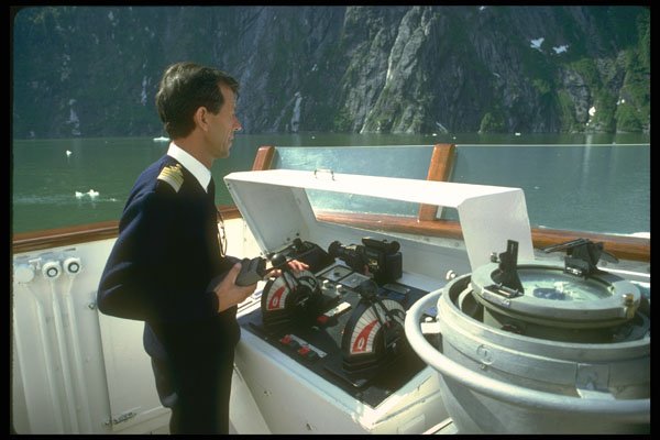 309051 Captain Sails Through Fjord A4 Photo Print