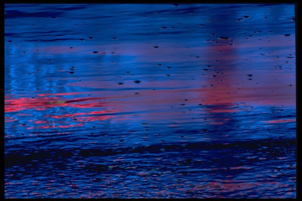 313005 Blue & Red Neon Light Reflected On Wet, Smooth Asphalt A4 Photo Print