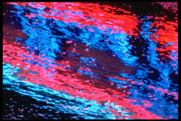 313022 Blue & Red Neon Light Reflecting In Pooled Water On Asphalt A4 Photo Print