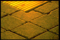 313044 Yellow Light Reflecting Off Stones In Water Fountain A4 Photo Print