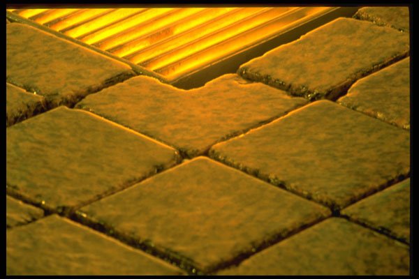 313044 Yellow Light Reflecting Off Stones In Water Fountain A4 Photo Print