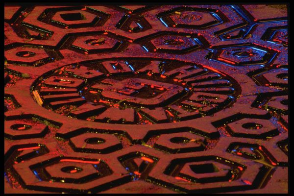 313057 Red Light Reflecting Off Wet Manhole Cover A4 Photo Print