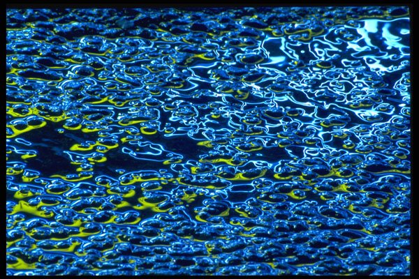 313060 Yellow, Blue, White Neon Light Reflected On Wet Asphalt A4 Photo Print