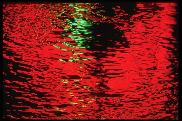 313063 Red & Green Neon Light Reflecting Off Pool Of Rain Water A4 Photo Print