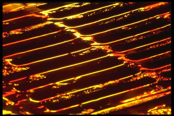 313076 Light Reflections Off Wet Catch Basin Grate A4 Photo Print