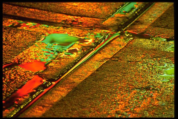 313079 Multi coloured Lights Reflecting Off Wet Concrete Sidewalk A4 Photo Print
