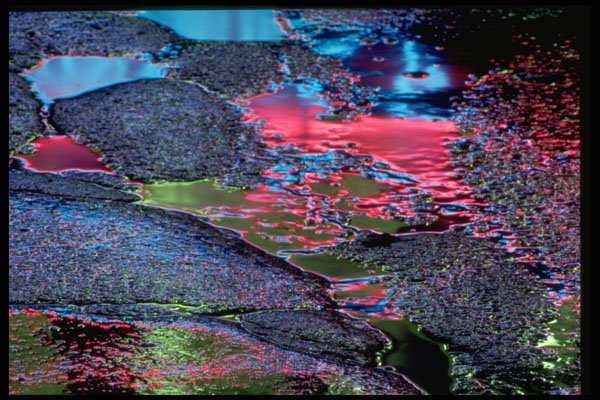 313085 Blue, Red, Green Light Reflected On Wet Cracked Asphalt A4 Photo Print