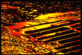 313096 Red & Yellow Neon Light Reflecting Off Rain Water A4 Photo Print