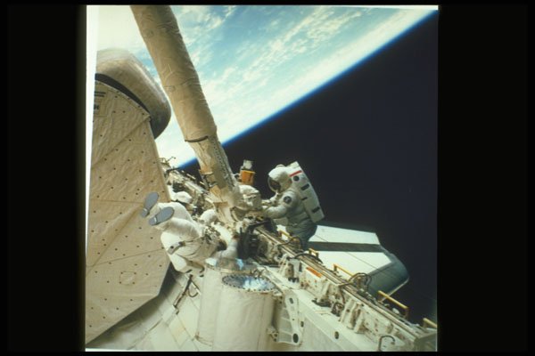 323008 Working On The Shuttle In Space A4 Photo Print