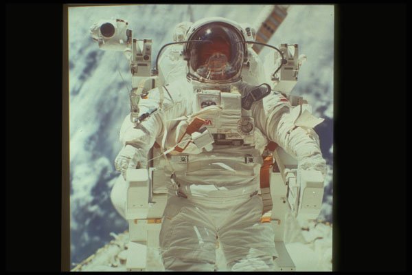 323061 Astronaut In Space A4 Photo Print