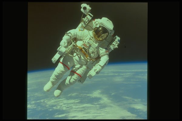 323062 Astronaut In Space A4 Photo Print