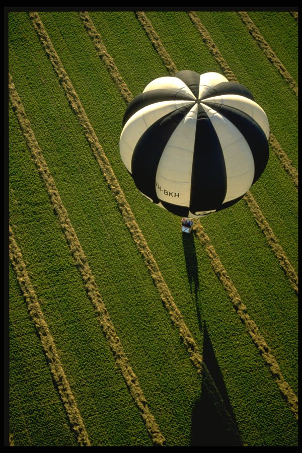 329038 Balloon Over A Hay Field, Australia A4 Photo Print