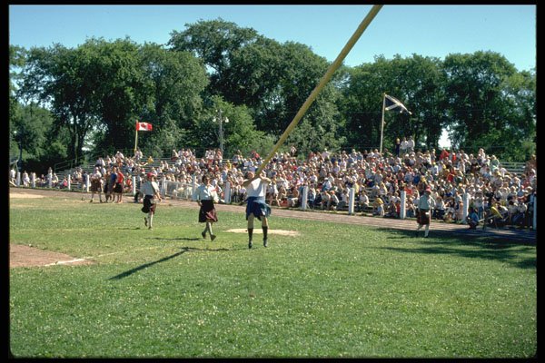 365096 Tossing Caber At Highland Games, Nova Scotia A4 Photo Print